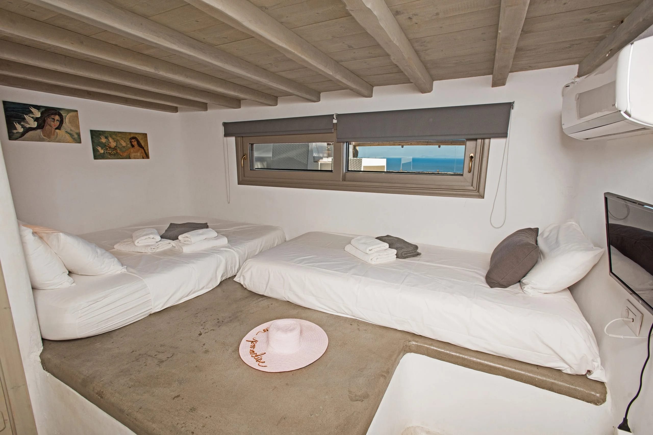 a couple of beds in a room