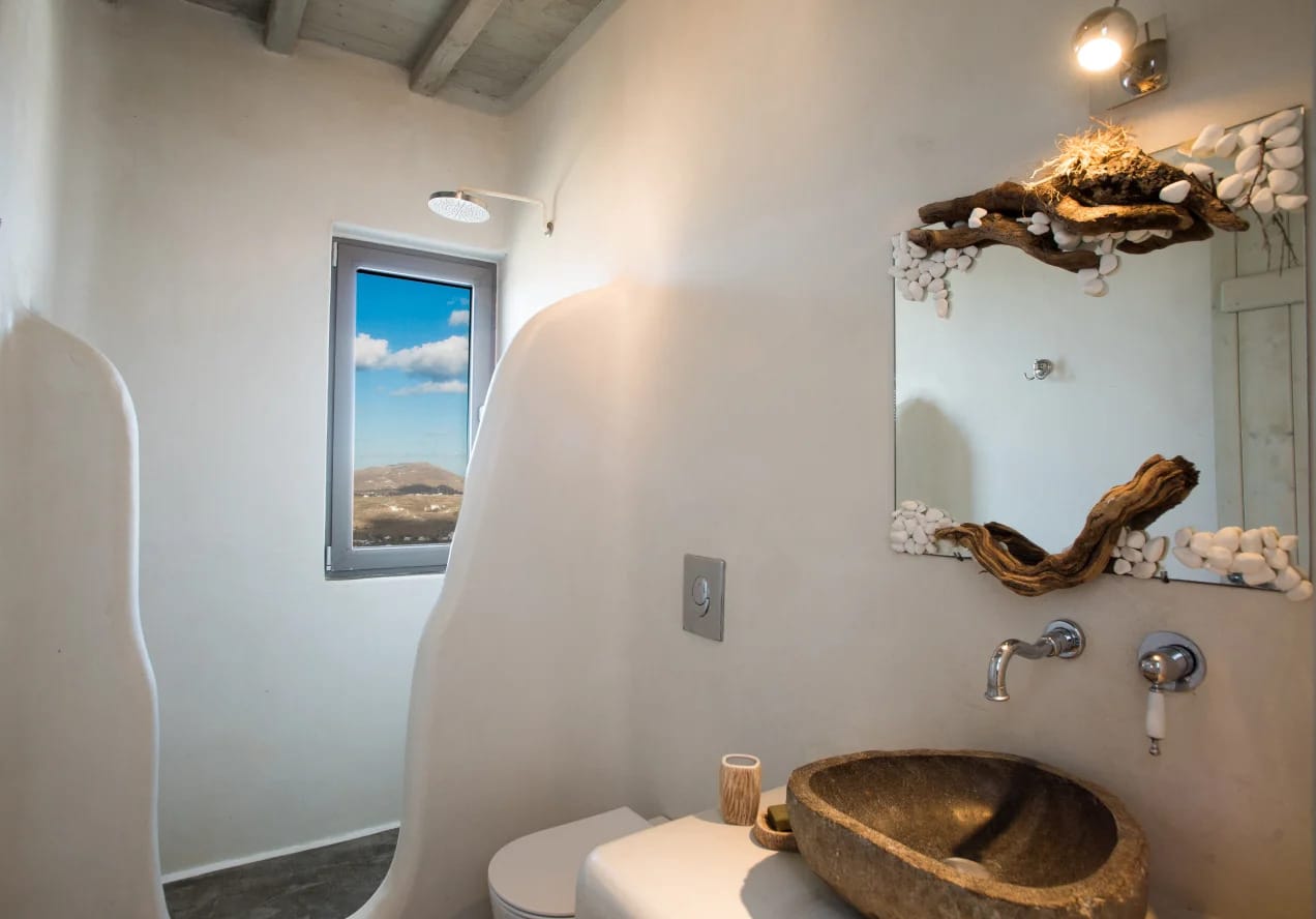 a bathroom with a mirror and sink