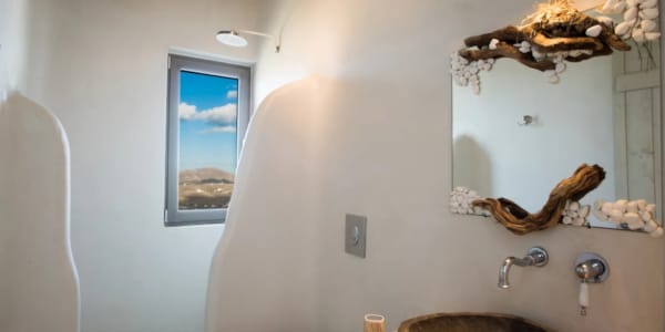 a bathroom with a mirror and sink