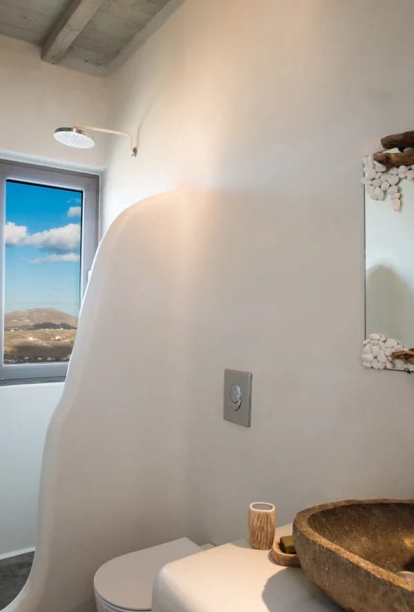 a bathroom with a mirror and sink