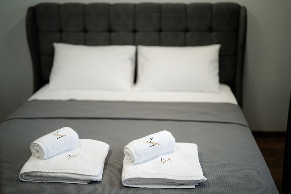 a bed with white pillows
