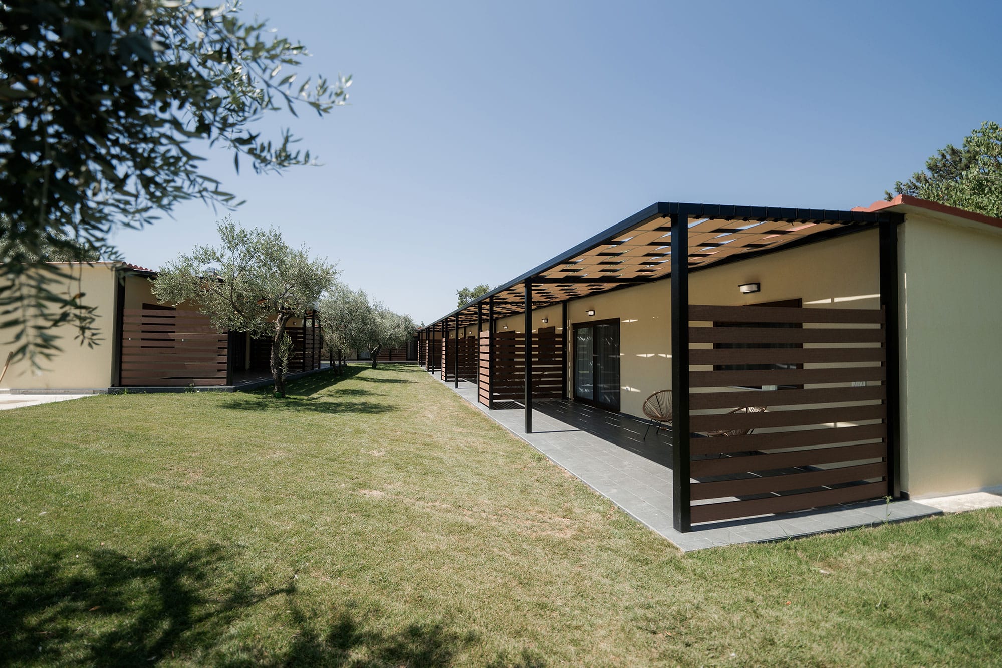 a building with a grass yard