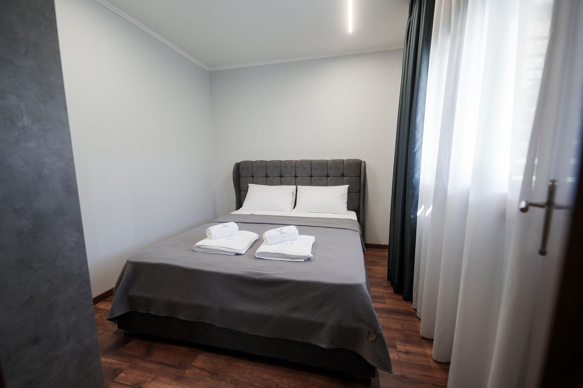 a bed with white towels on it