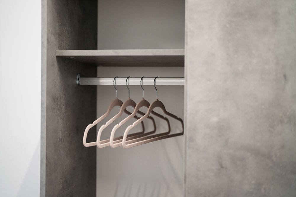 a white string tied to a metal bar