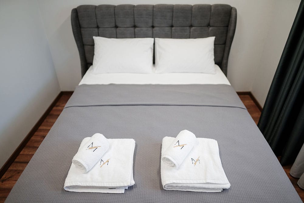 a bed with white pillows