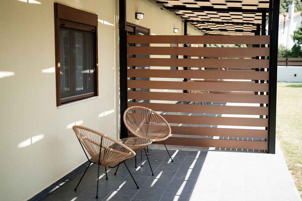 a couple chairs and a table outside