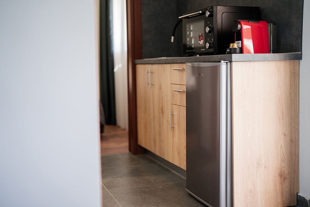 a kitchen with a microwave oven and refrigerator