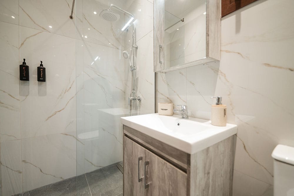 a bathroom with a shower and sink