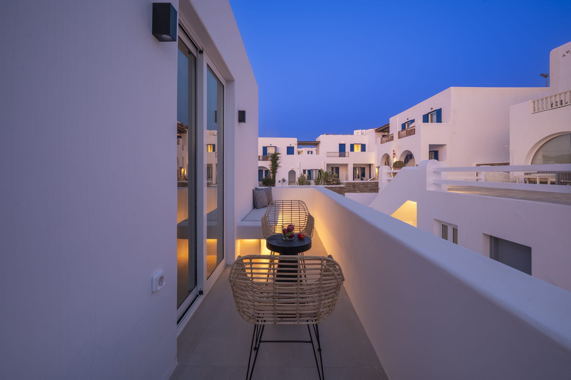 a table and chairs on a balcony