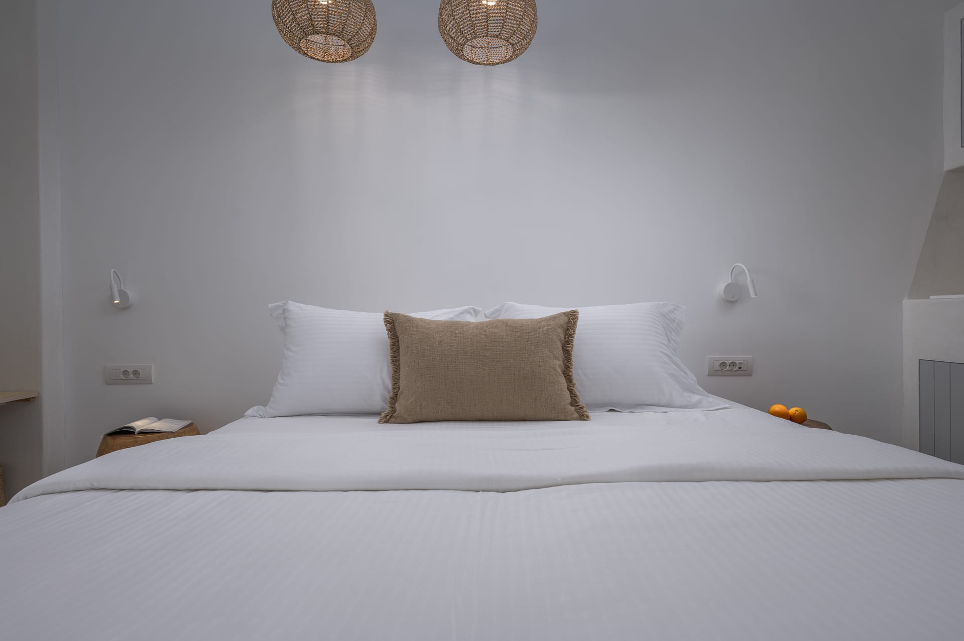 a bed with white sheets