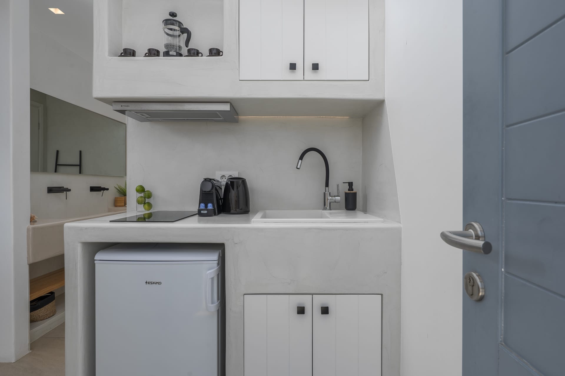 a kitchen with white cabinets
