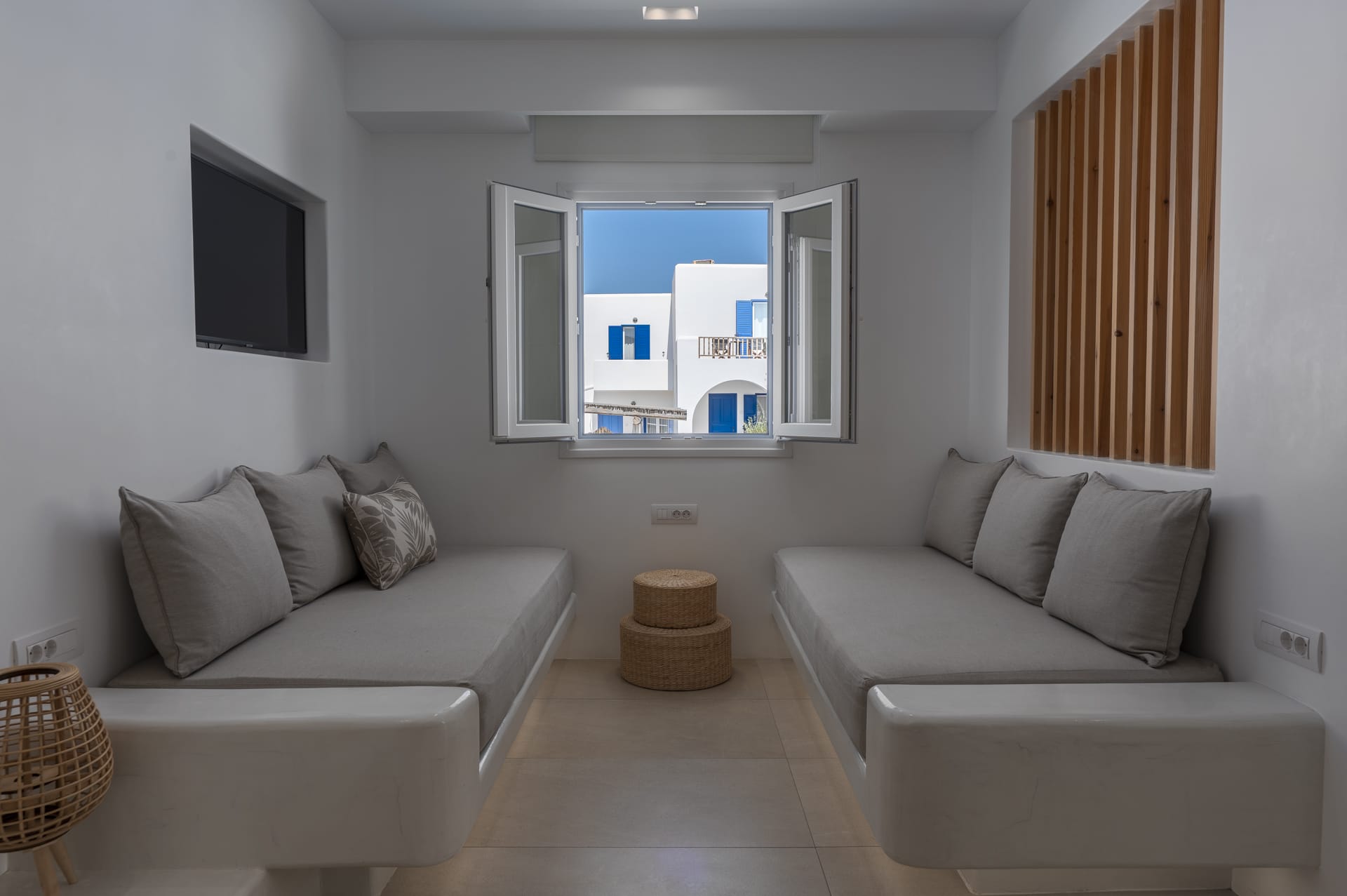 a living room with a tv and couches