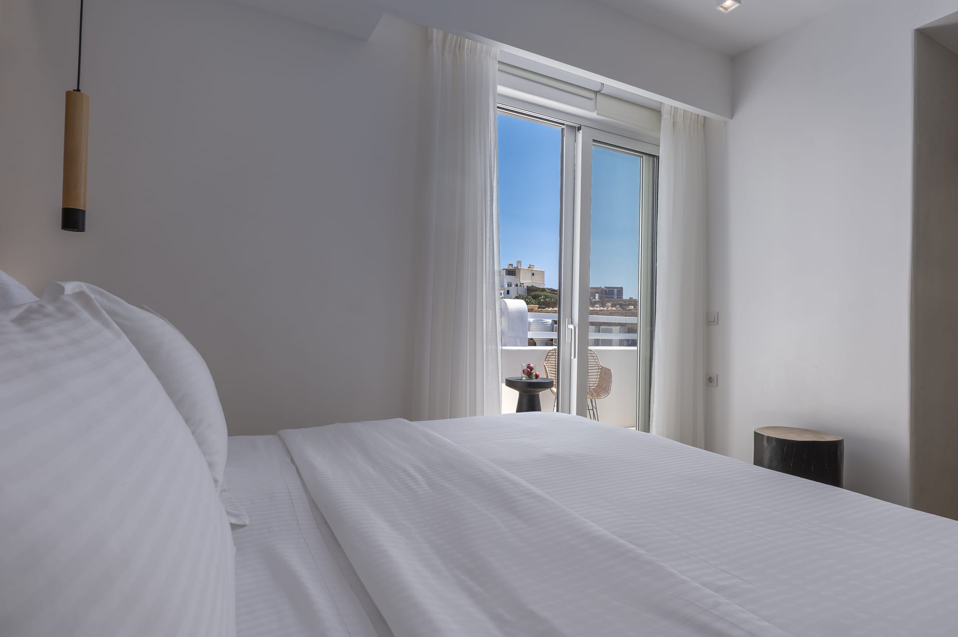 a bed with a white comforter