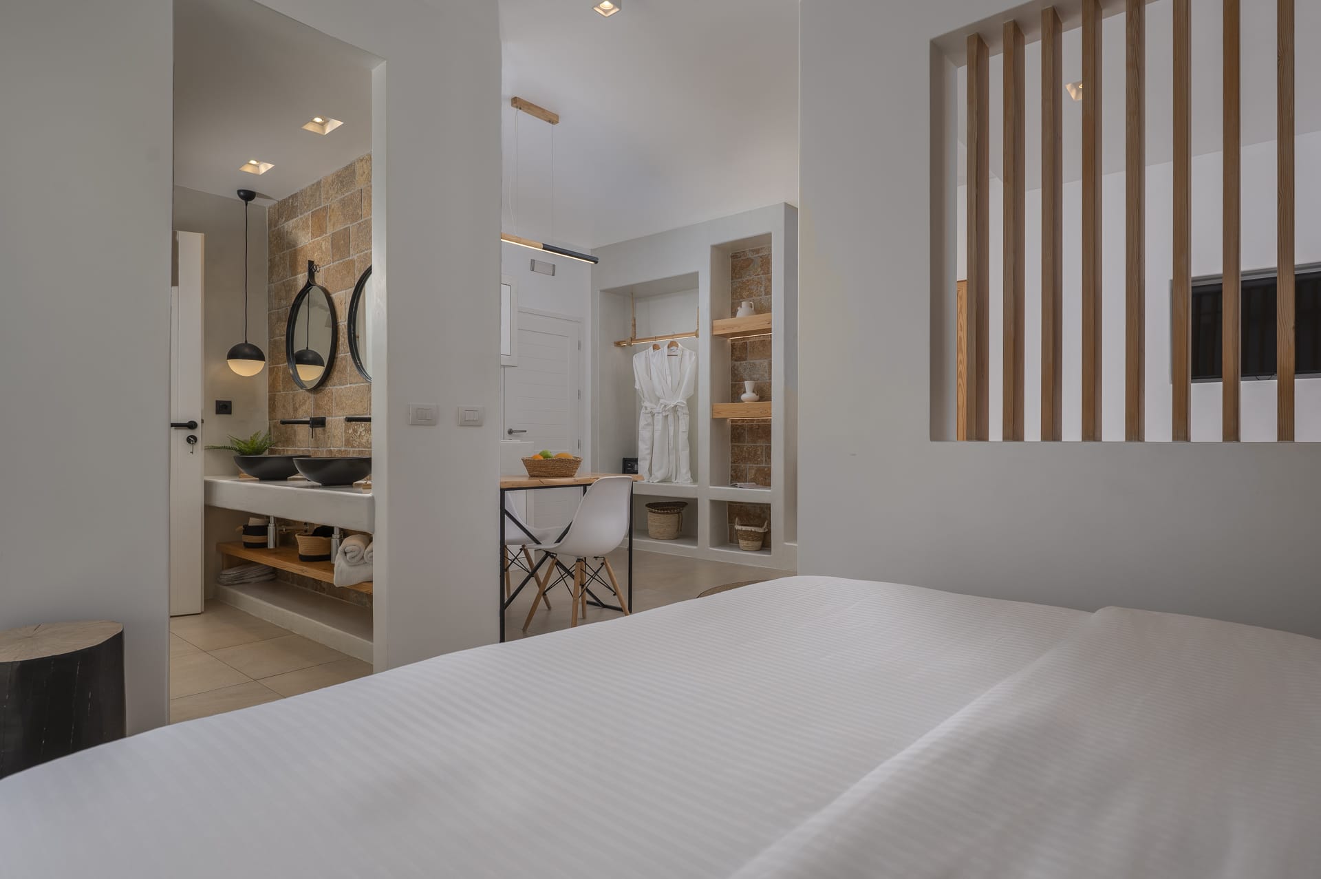 a bedroom with a bed and a desk