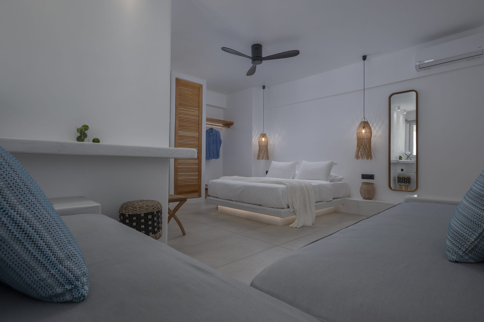 a bedroom with a bed and a couch