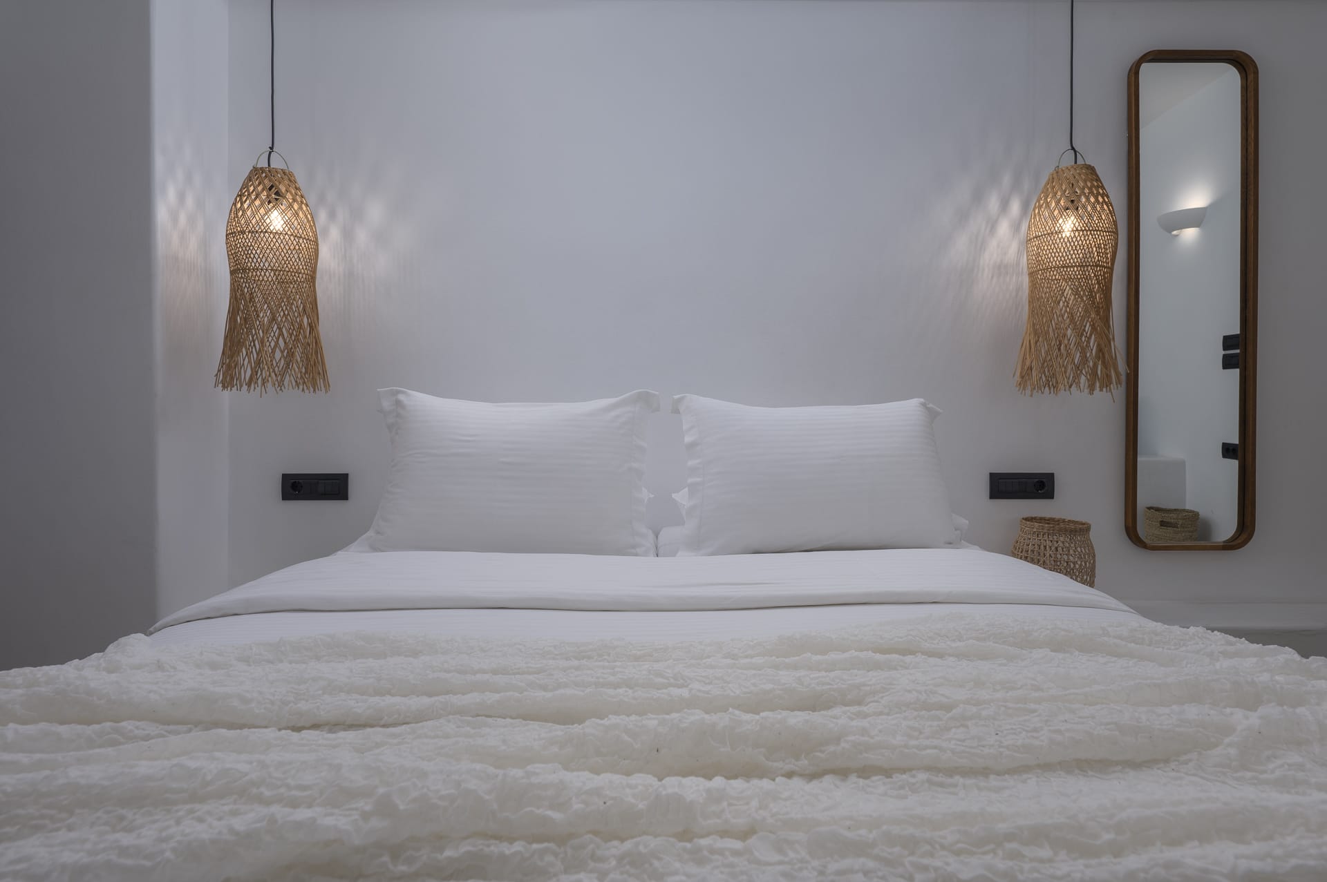 a bed with a white bed spread