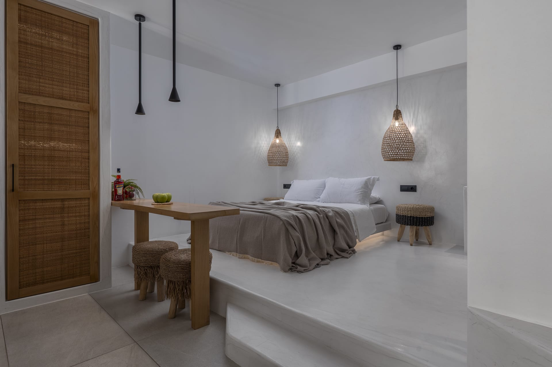 a bedroom with a bed and a table