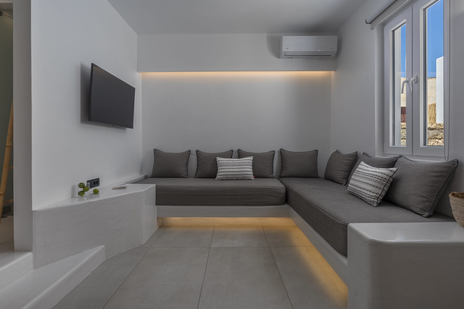 a living room with a couch and a tv