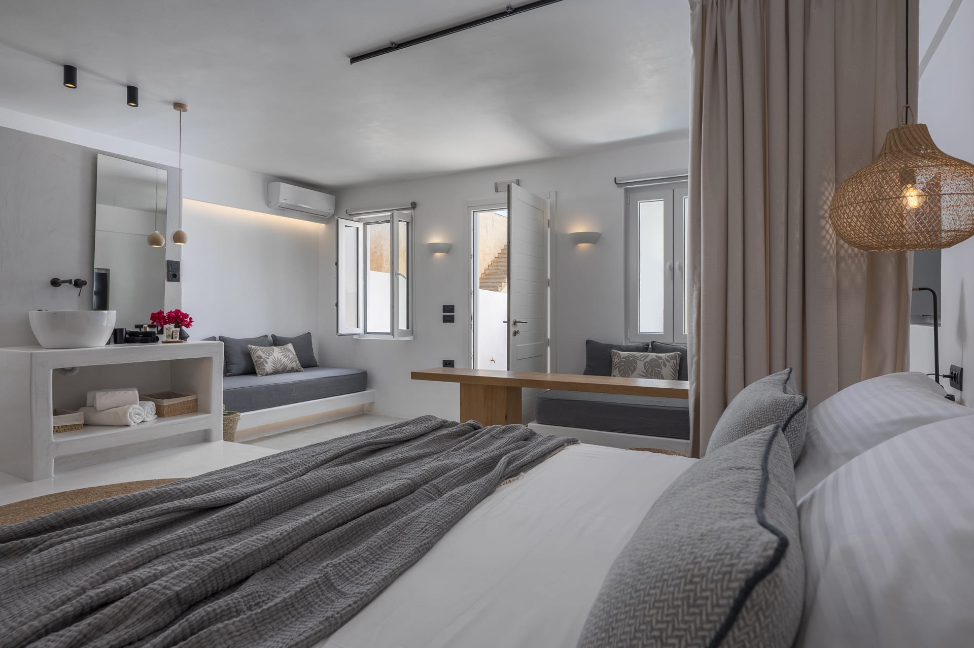 a bedroom with a bed and a mirror