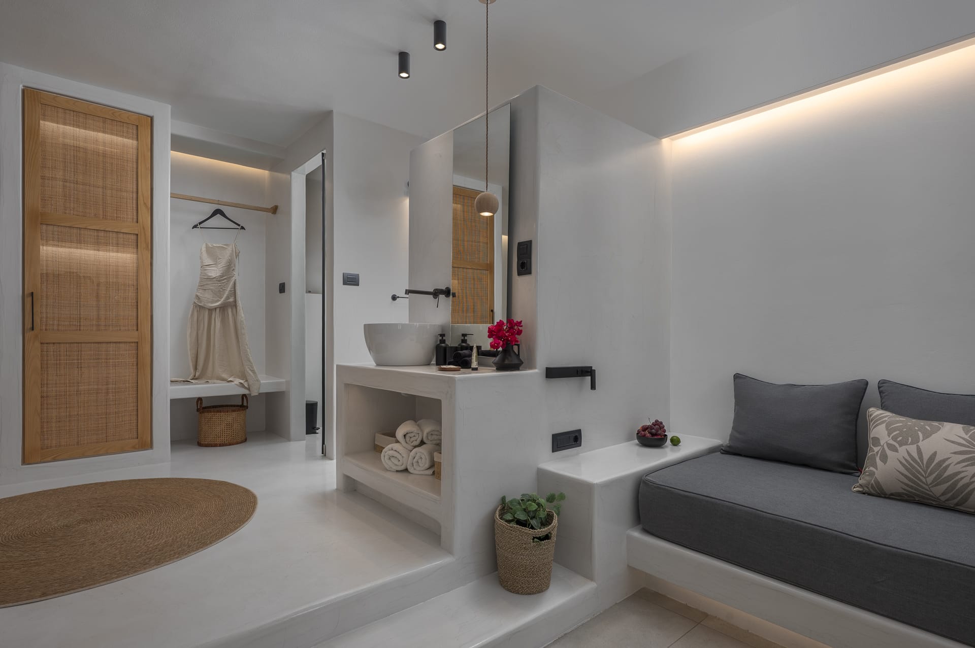 a bedroom with a bed and a mirror