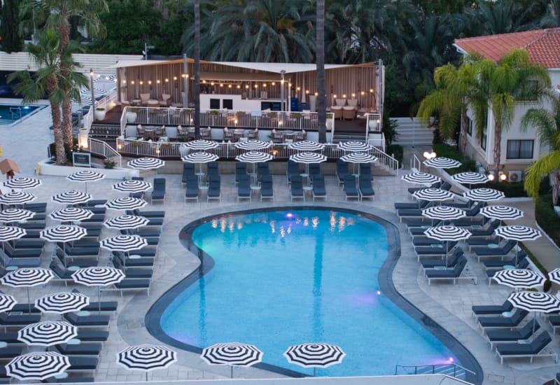 a pool with chairs around it