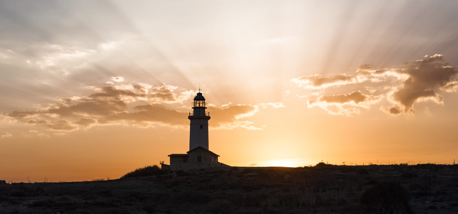 a lighthouse on a hill
