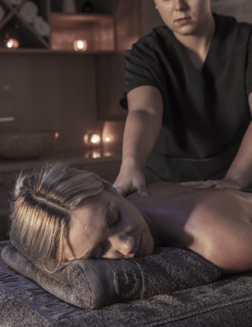 a person lying on a bed