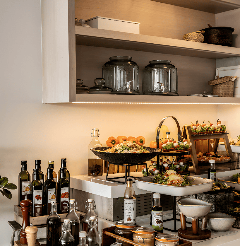 a kitchen with many bottles of alcohol