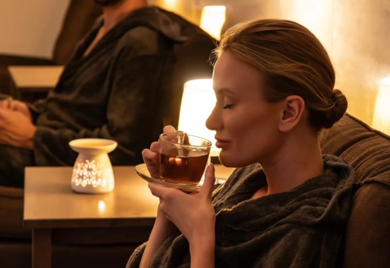 a person drinking from a glass