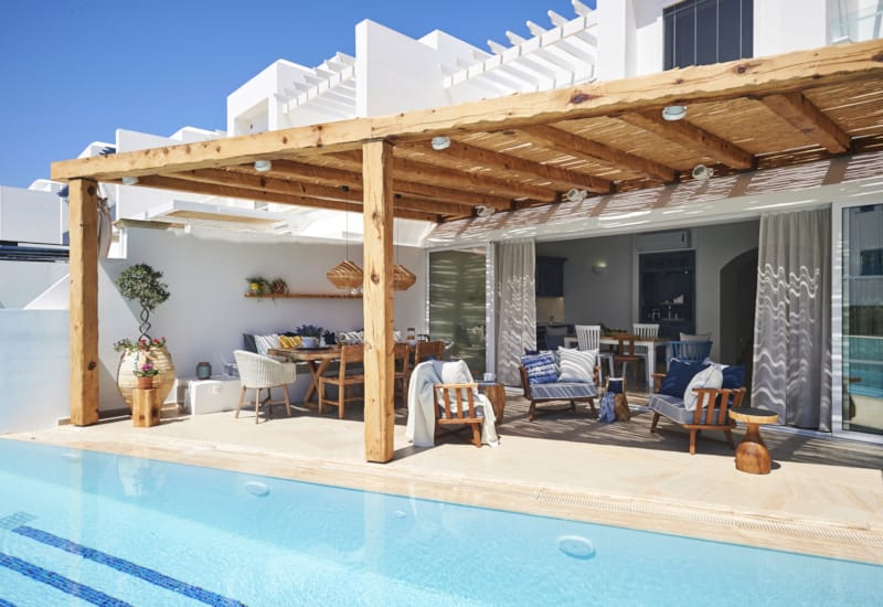 a pool with a covered patio