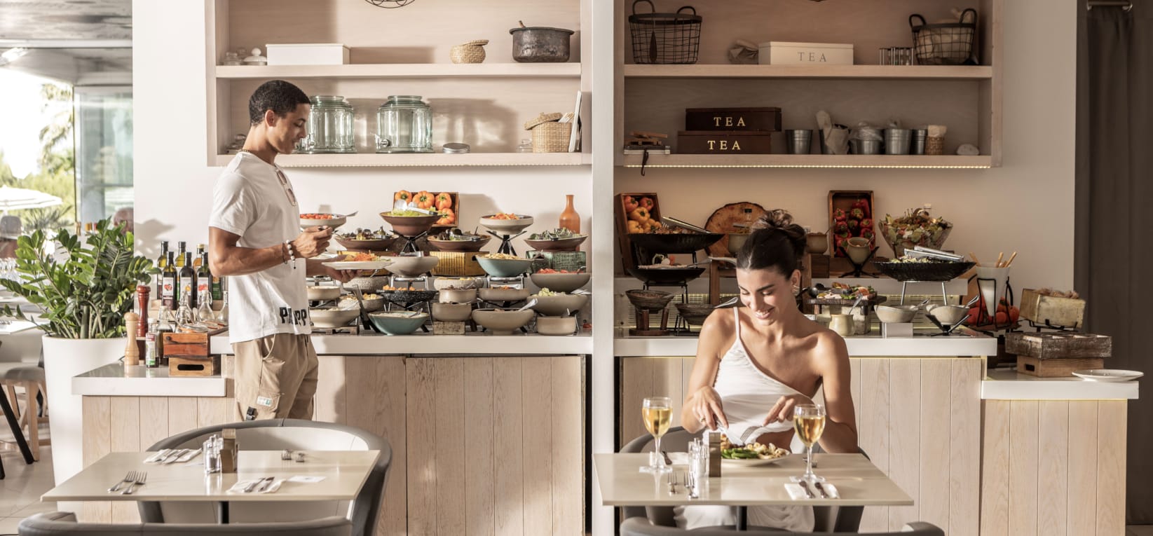 a man and woman in a kitchen