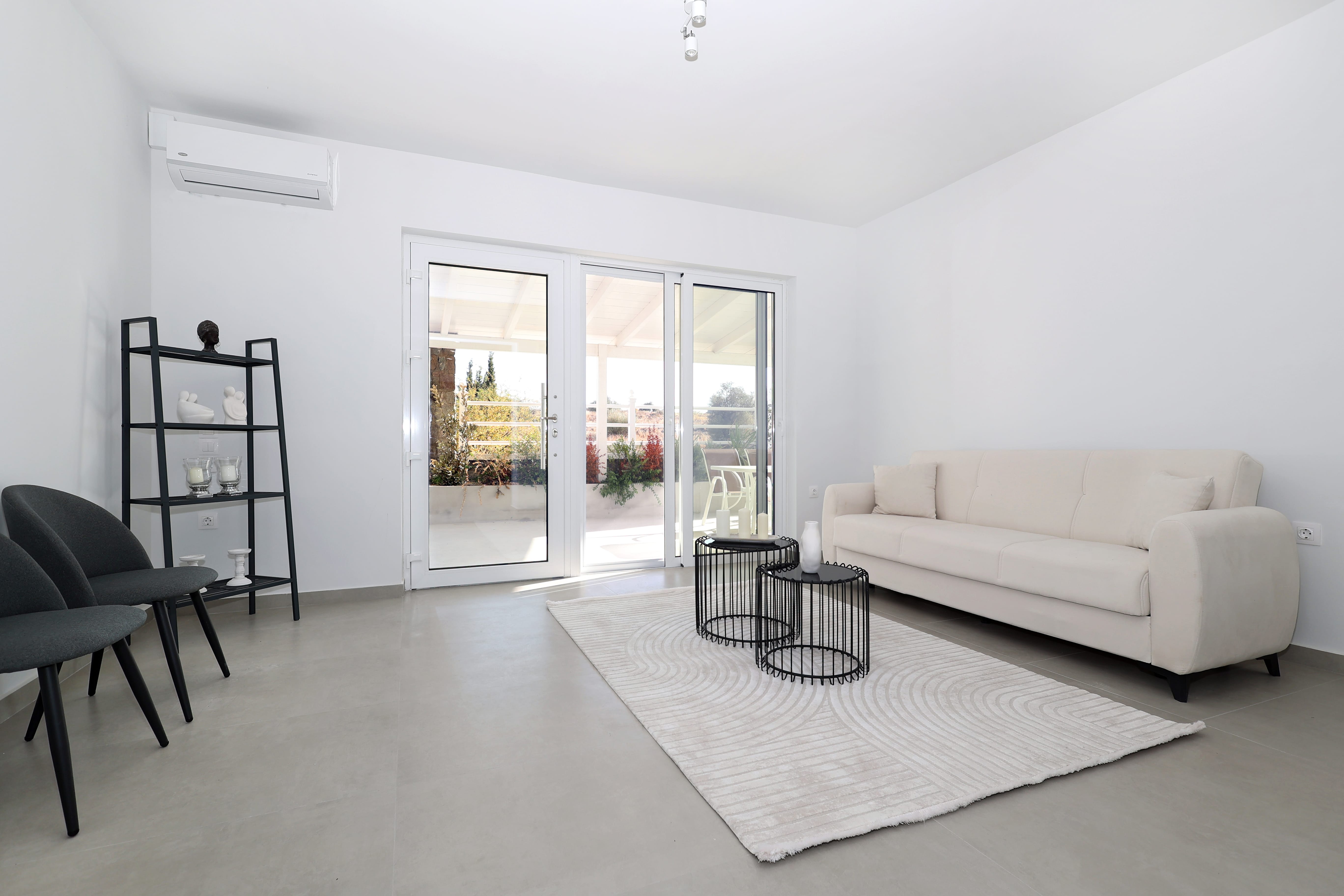 a living room with a white couch and a table