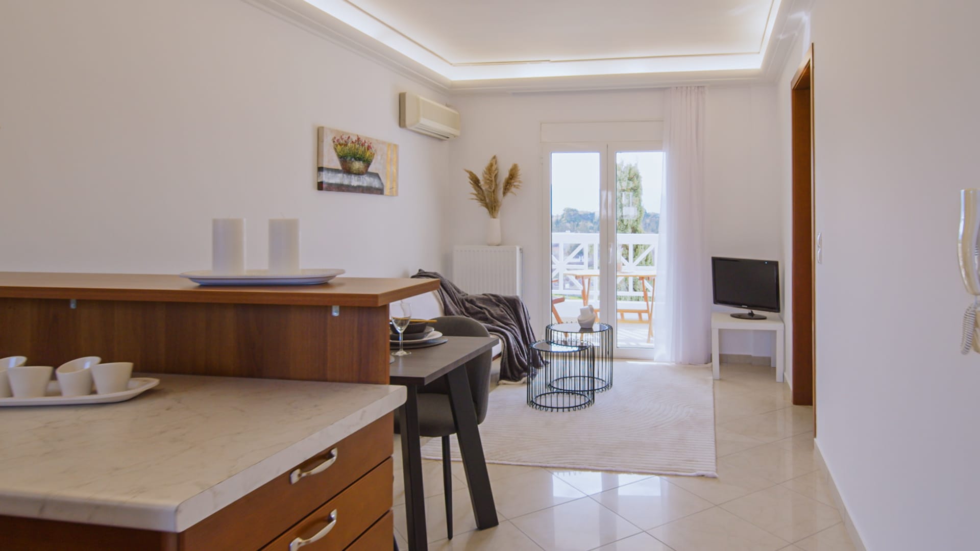 a room with a desk and chairs