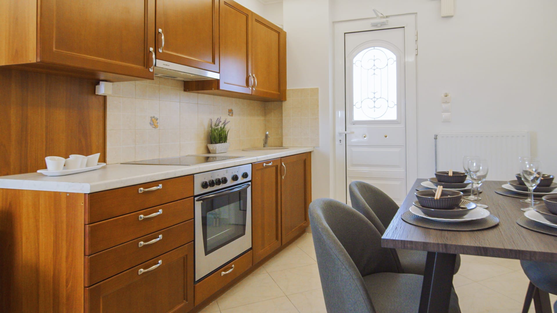 a kitchen with a table and chairs