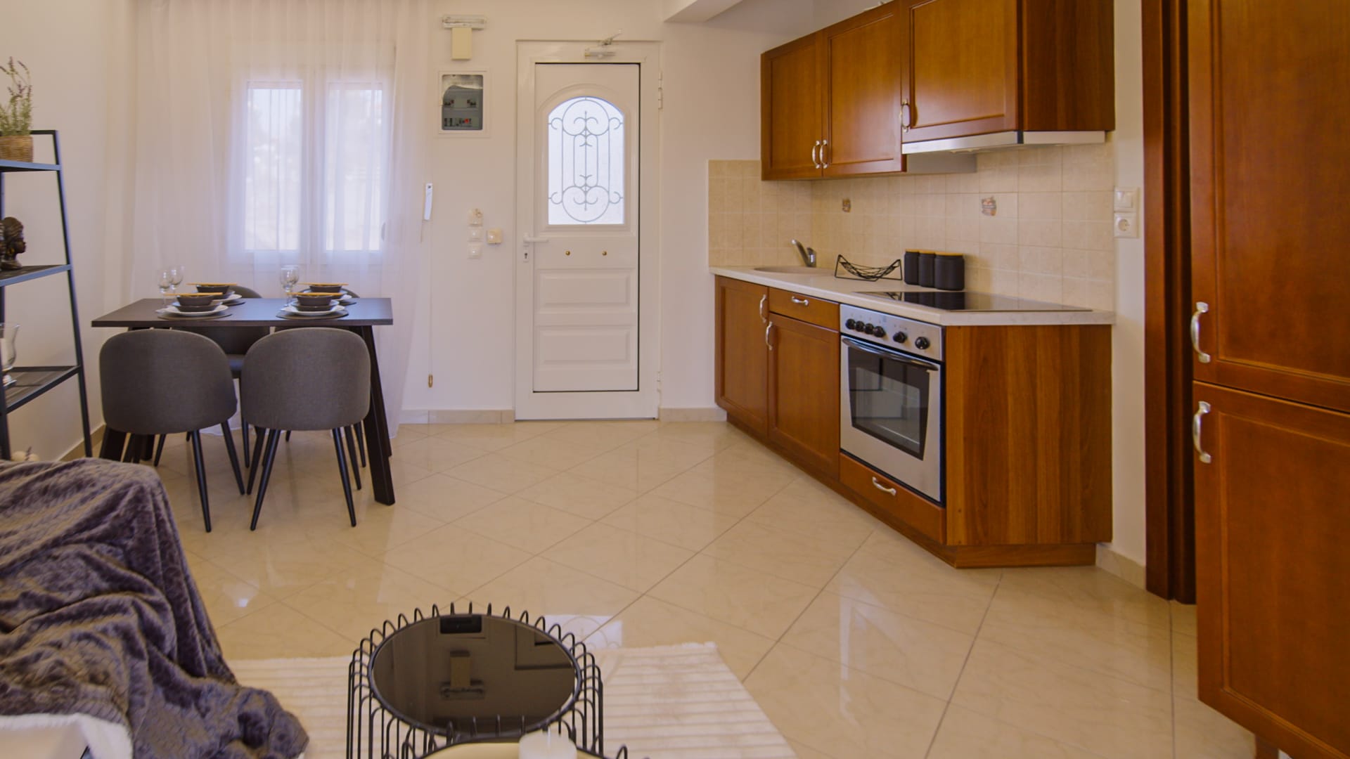 a kitchen with a table and chairs