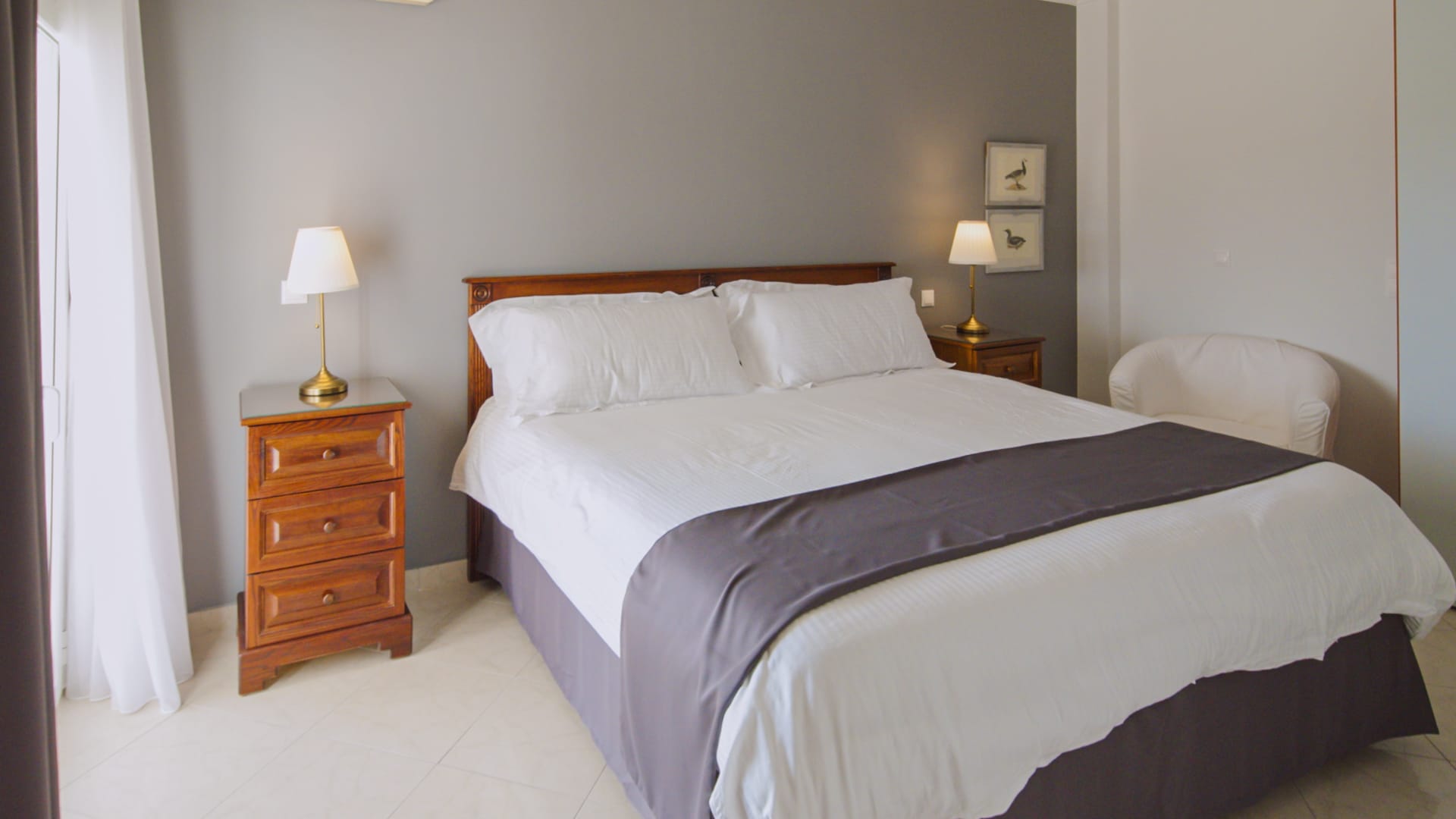 a bed with a white bed spread