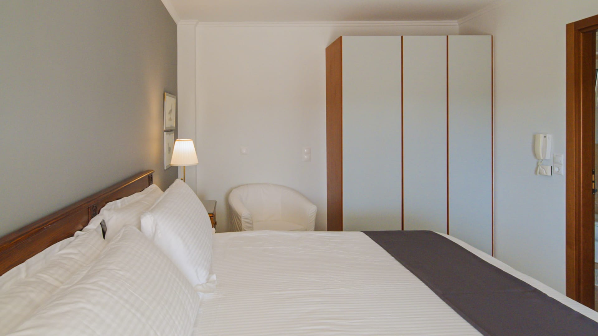 a bed with a white bed spread