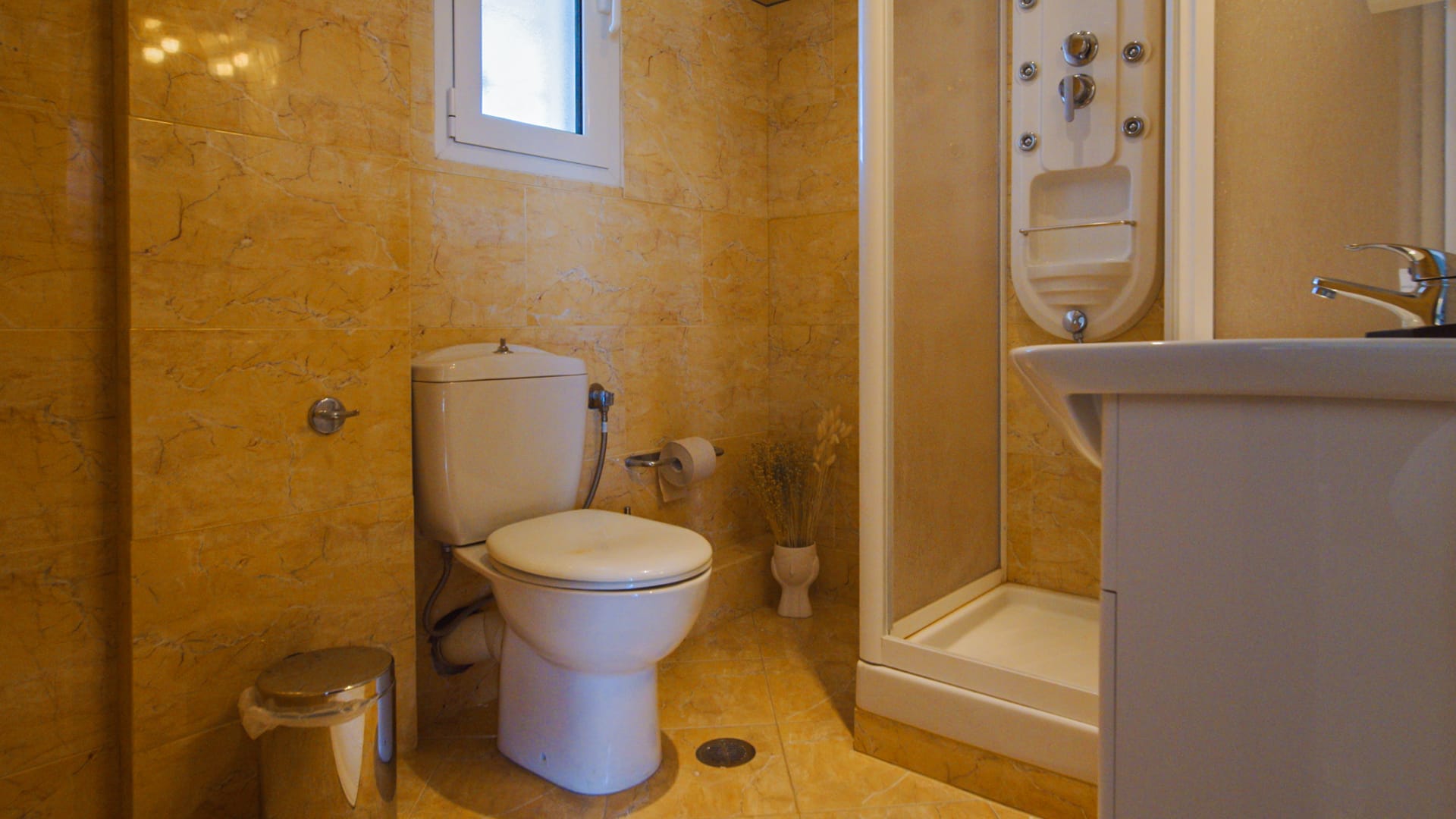 a bathroom with a toilet and sink