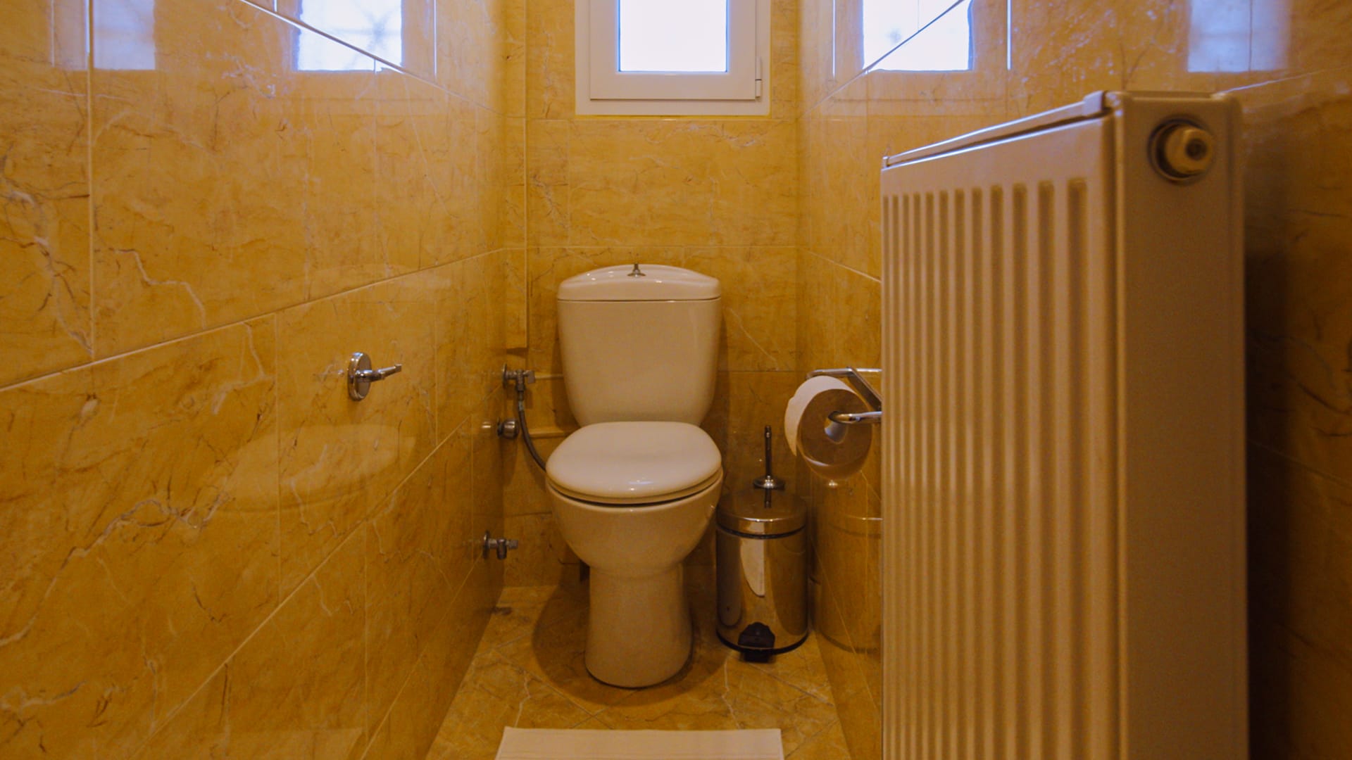 a bathroom with a toilet and sink