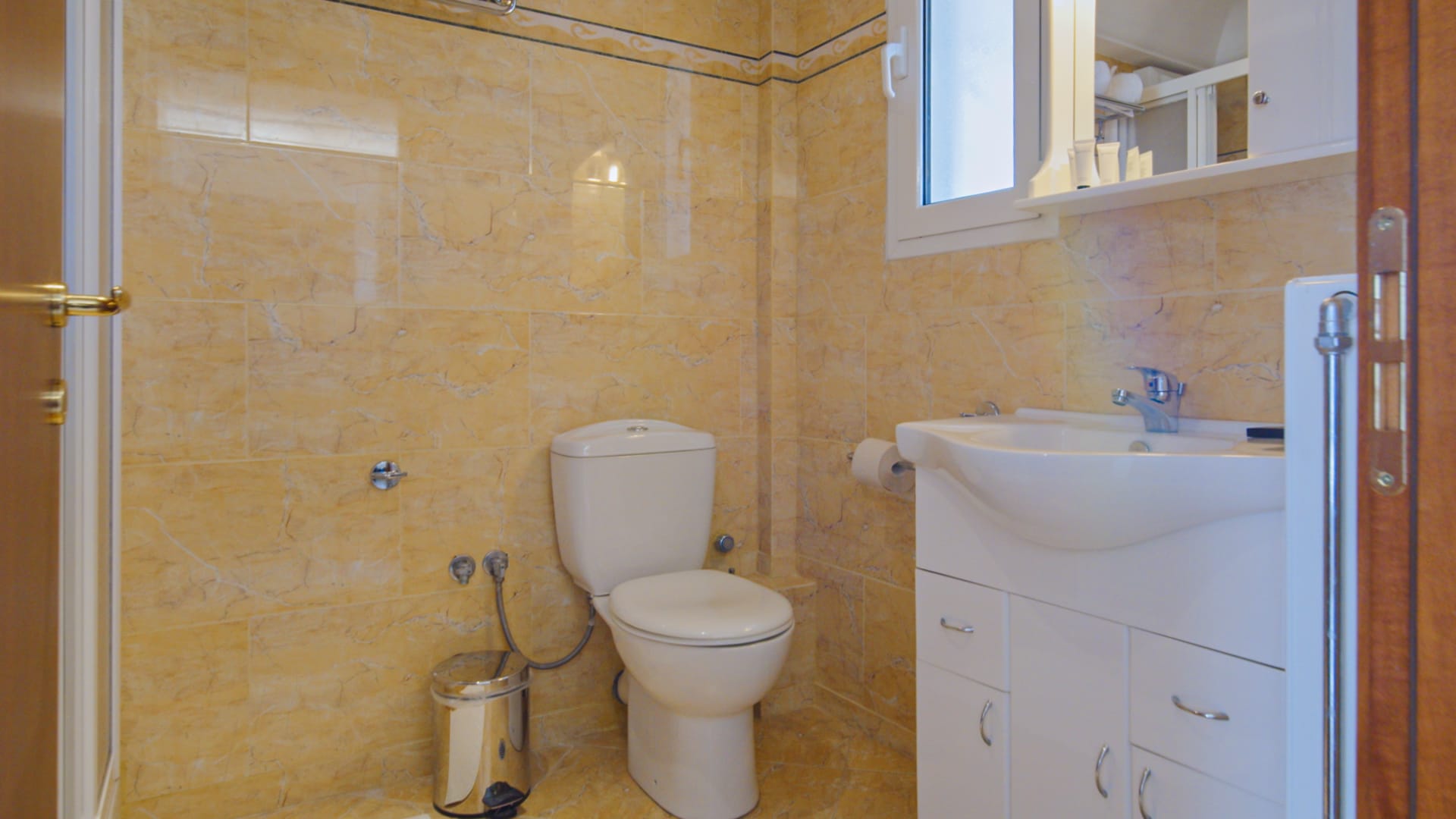 a bathroom with a toilet and sink