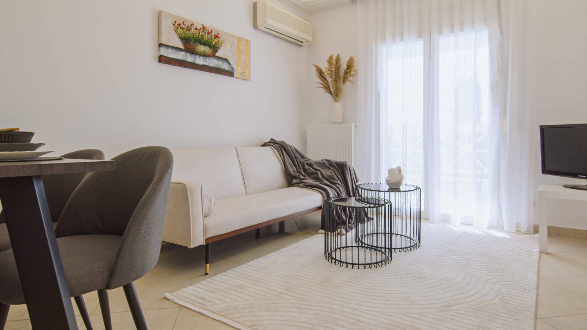 a living room with a white couch and a coffee table