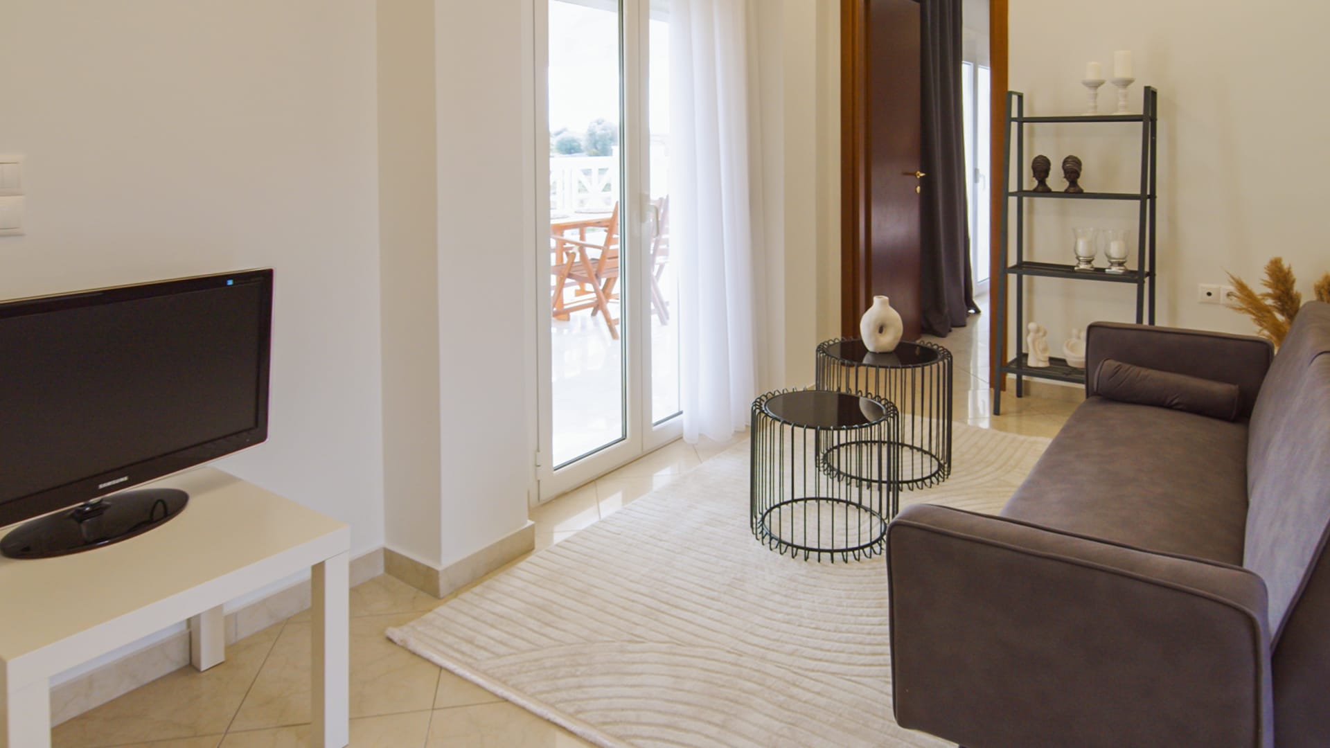 a living room with a tv and a couch