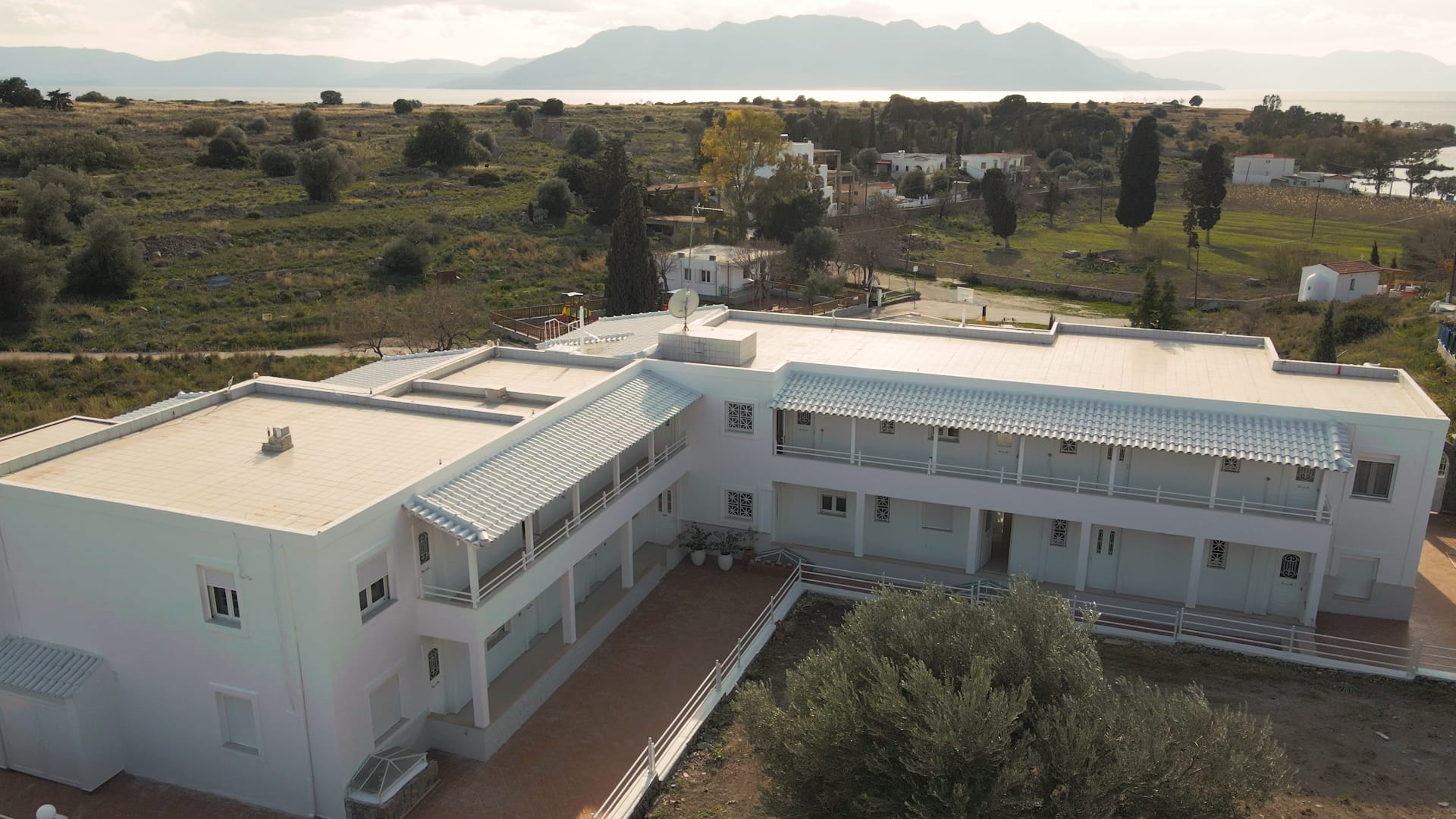a building with trees in the back
