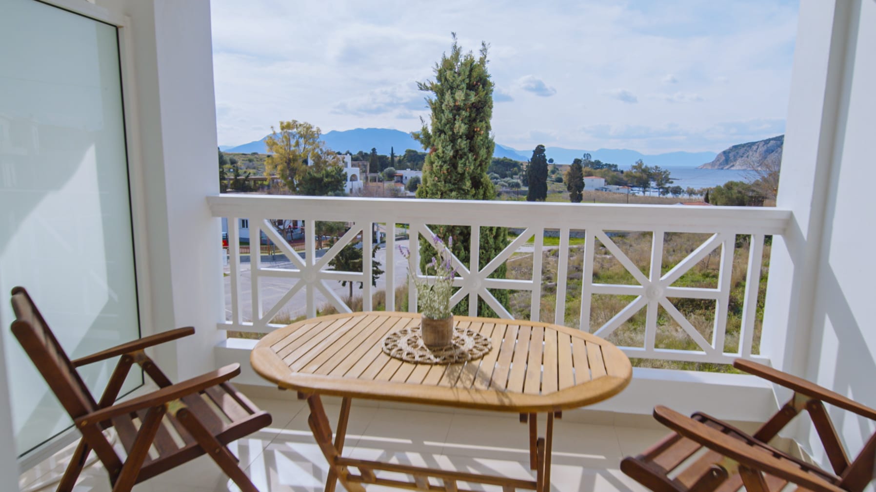 a table and chairs on a balcony