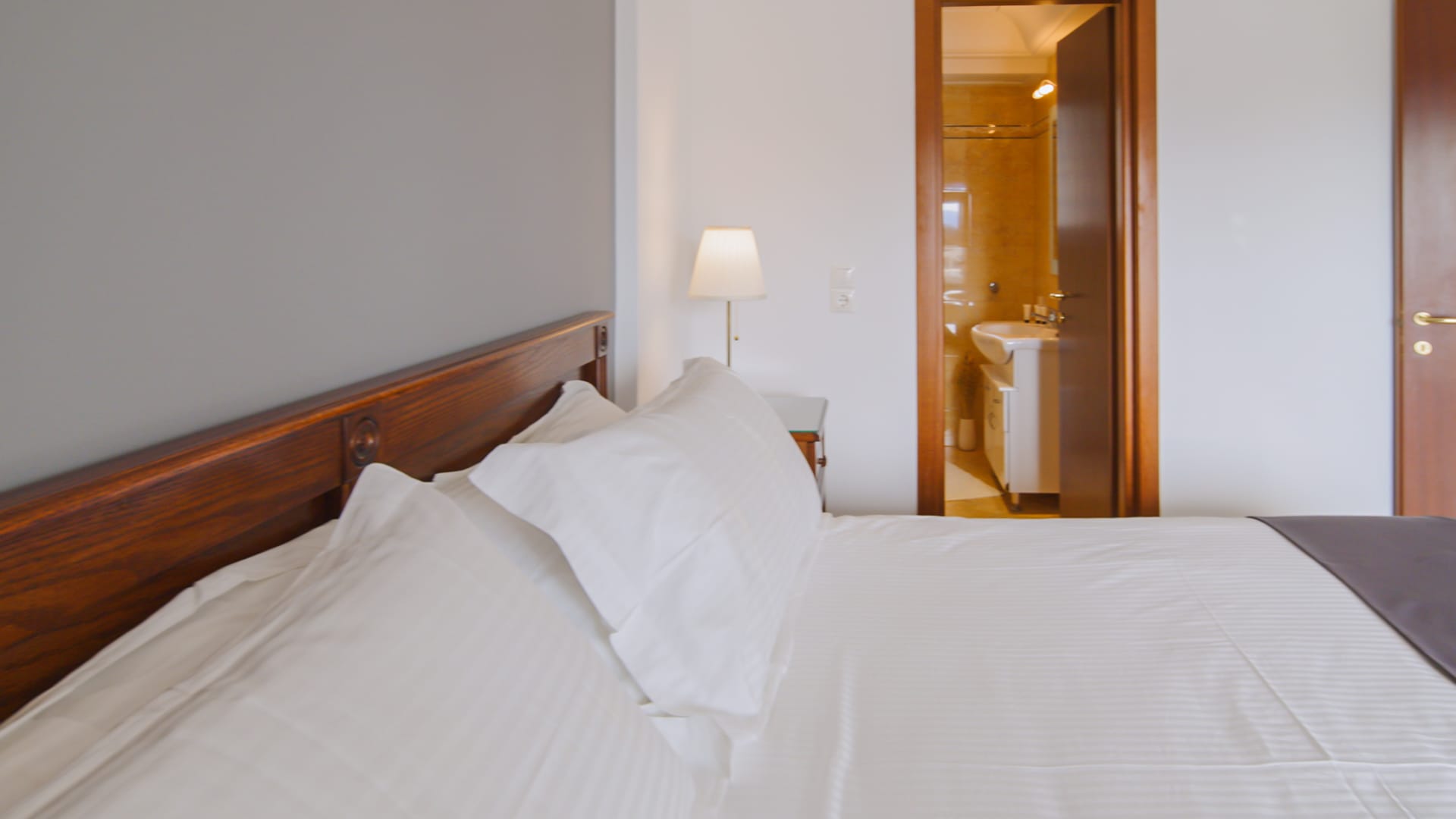 a bed with white sheets