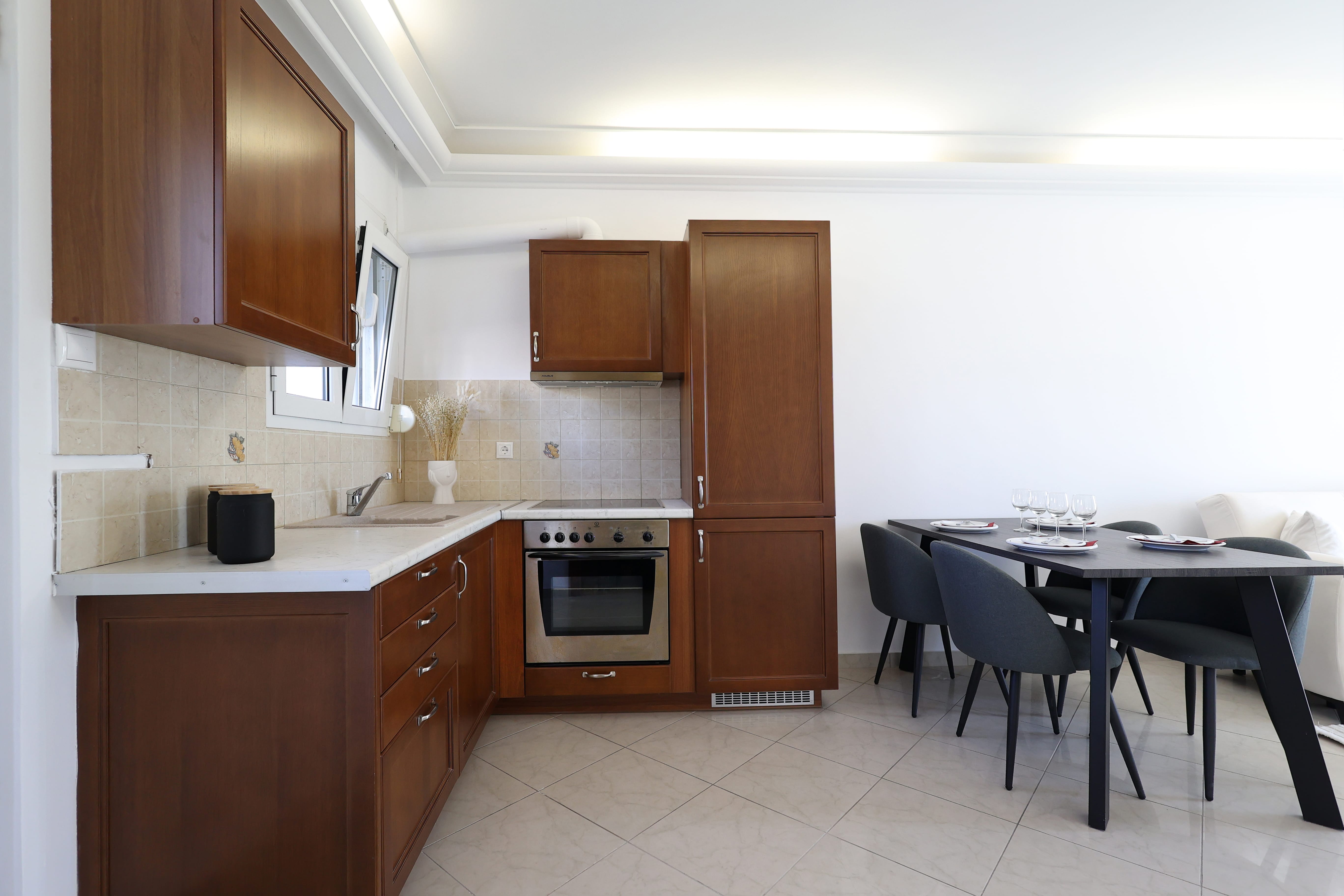 a kitchen with a table and chairs