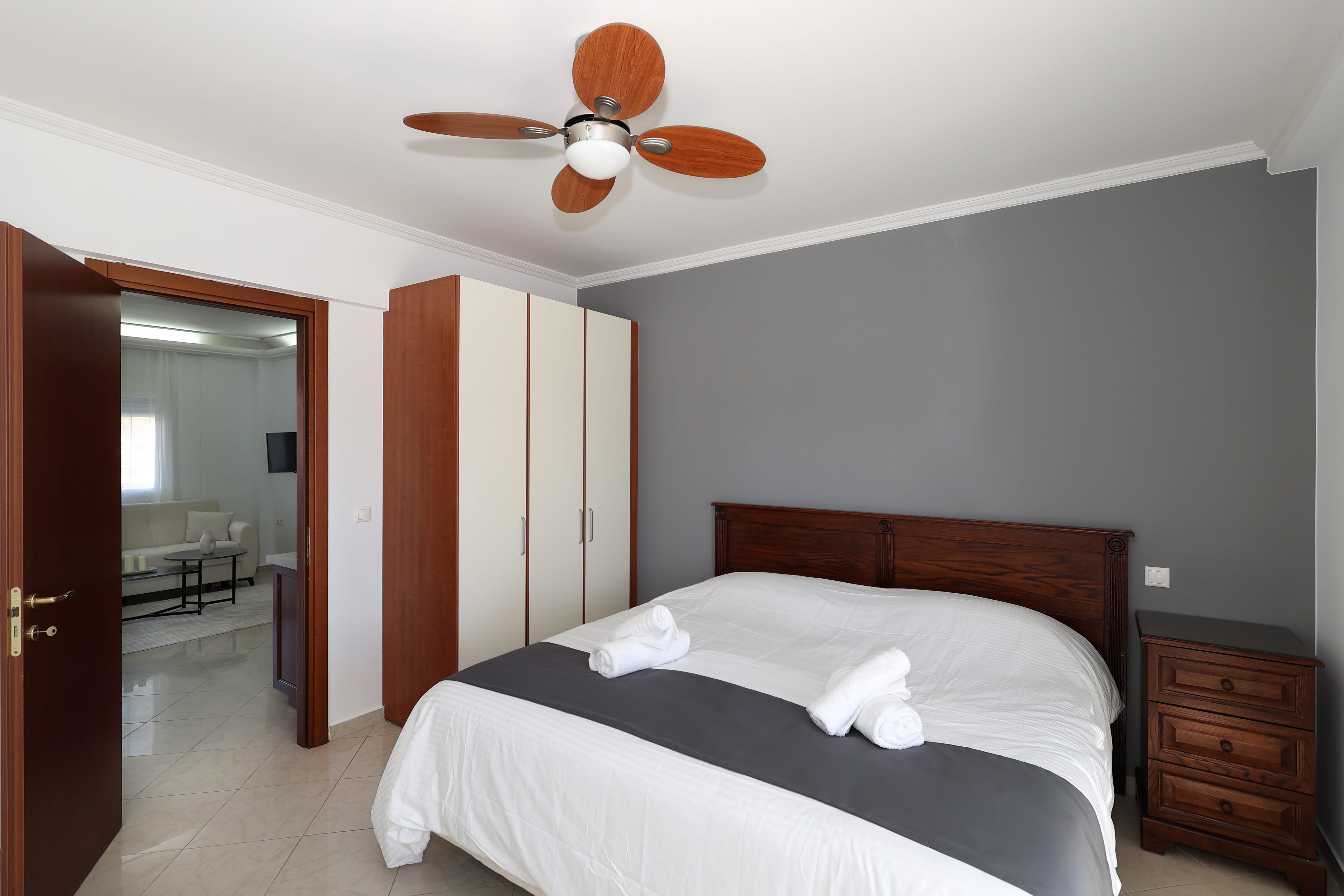 a bedroom with a fan