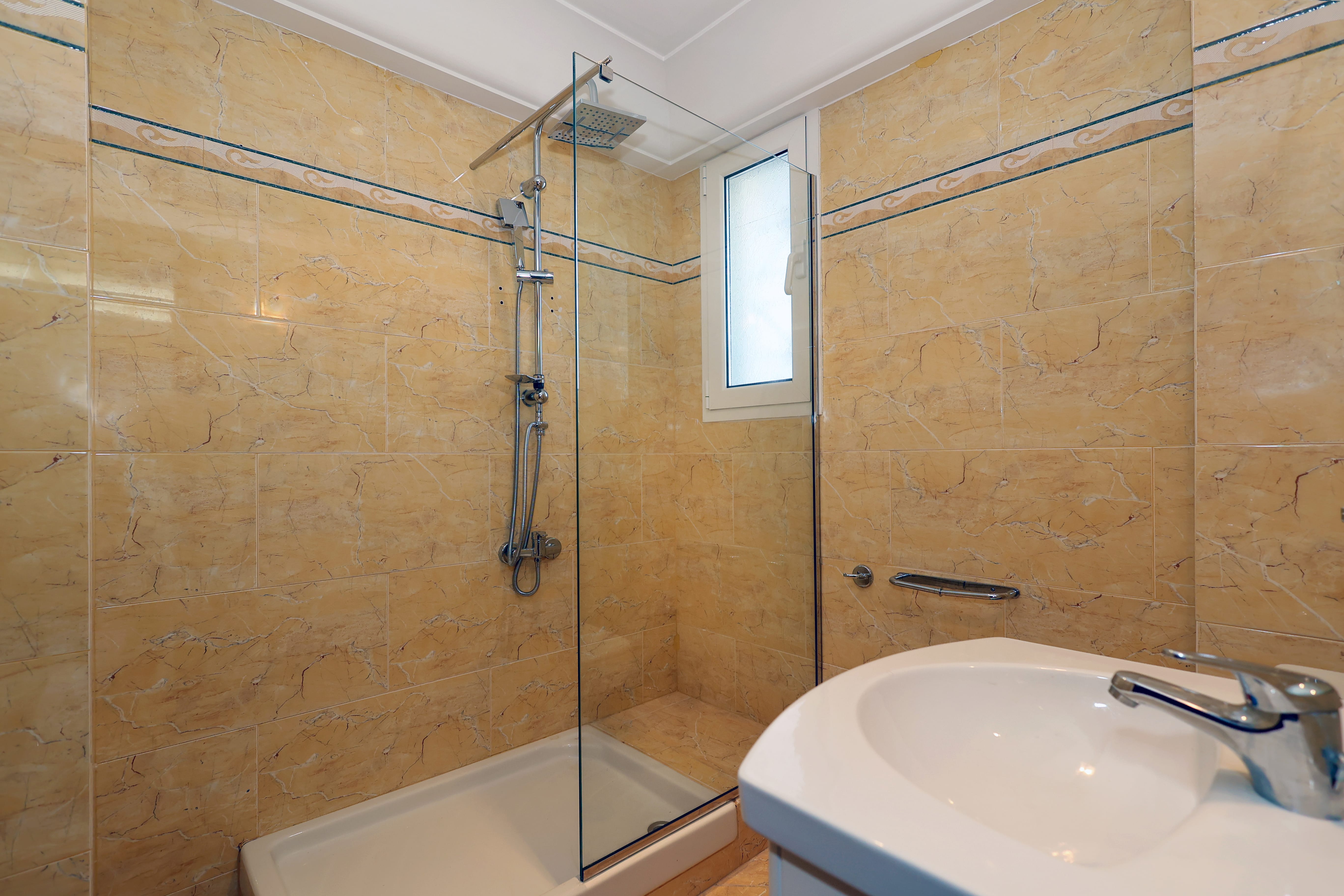 a bathroom with a sink and shower