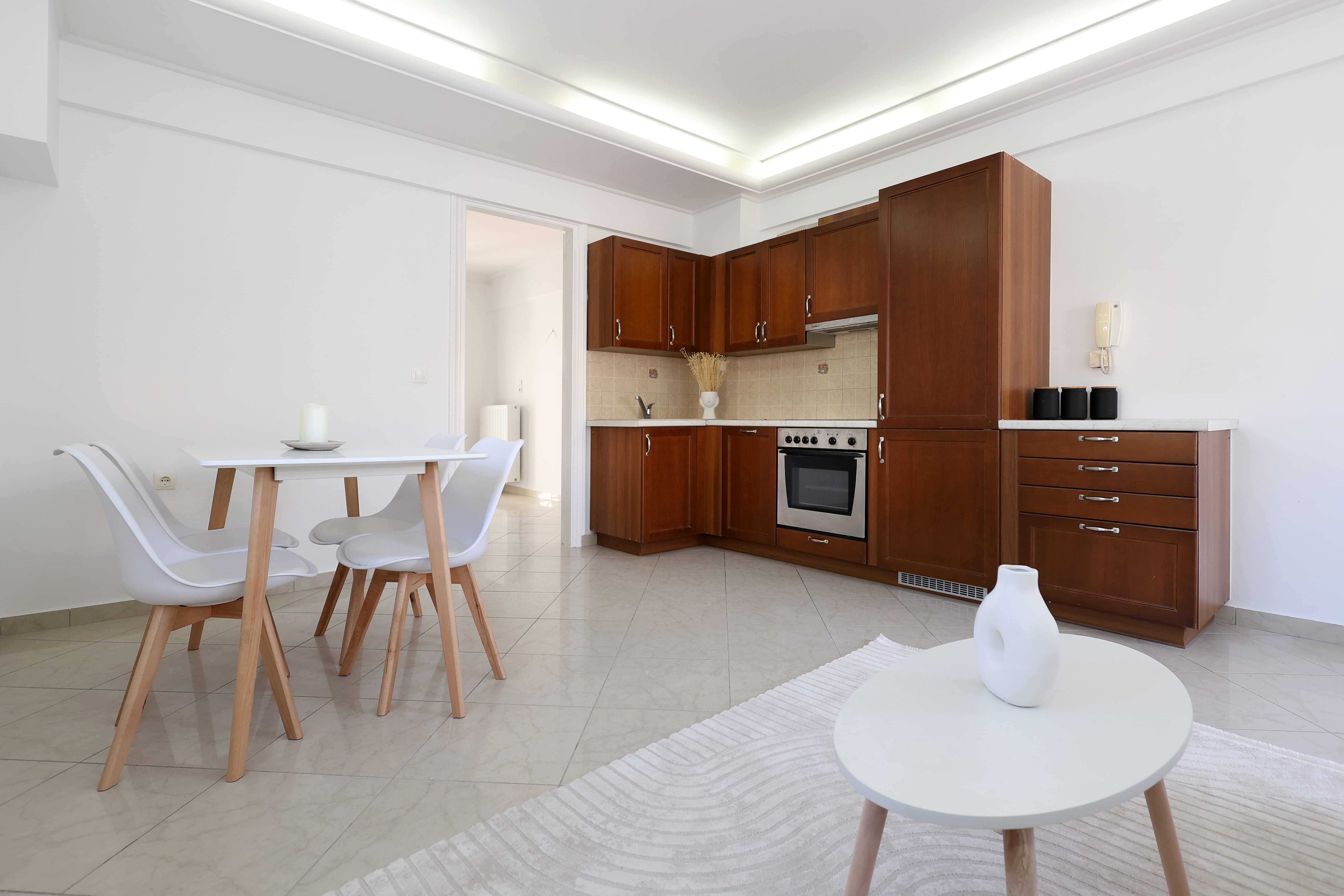a kitchen with a table and chairs