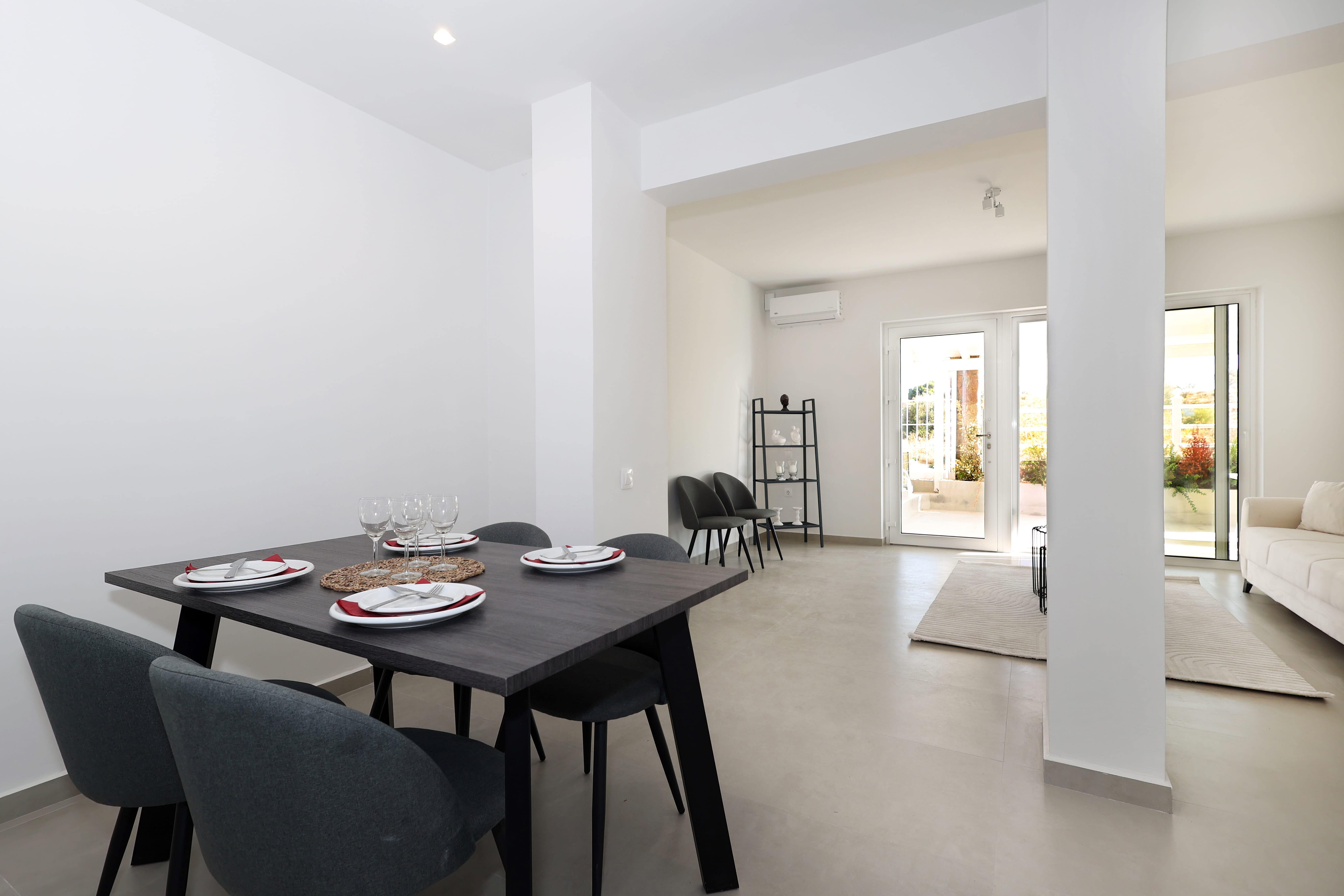 a dining room table with plates and chairs